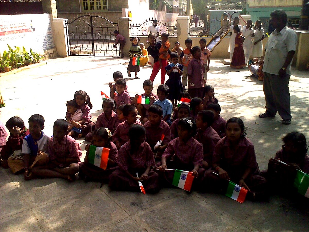 Children proudly holding the tricolour